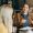 A female psychologist consults a client while sitting in the office and listening and watching carefully.
